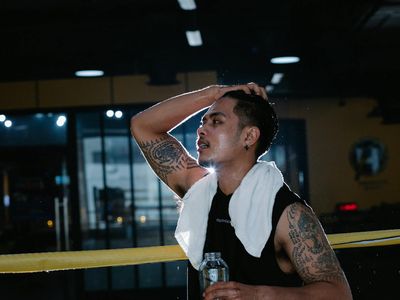 Bottle of water and a towel in a gym